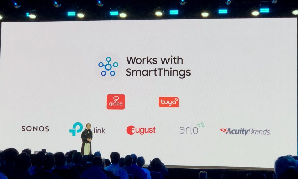 At the Samsung Developer Conference, a slide shows new brands, including Globe, Tuya, and Acuity Brands, that will with SmartThings.