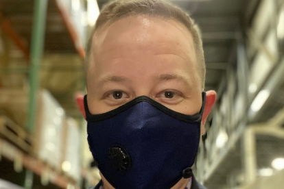 Adam Justice wearing a mask