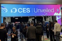 A lighted billboard above a ballroom entrance reads "CES Unveiled"